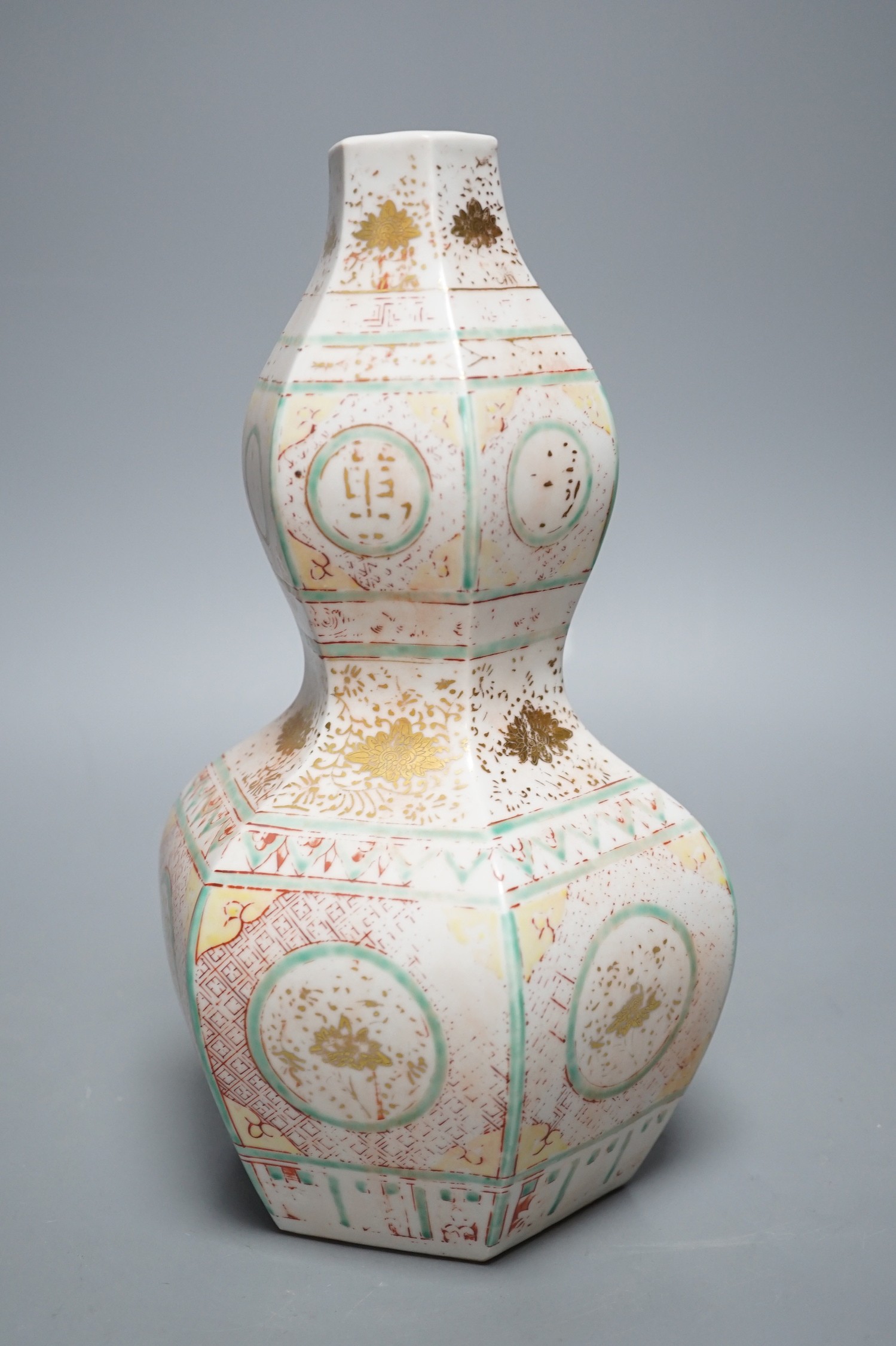 A Chinese famille rose gourd hexagonal shaped vase, Ming style, 28cm tall